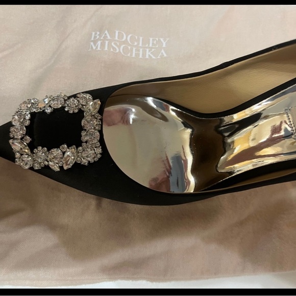 Size 9. Worn once for 3 hours. Extra heel tips and stones shoe bag original box